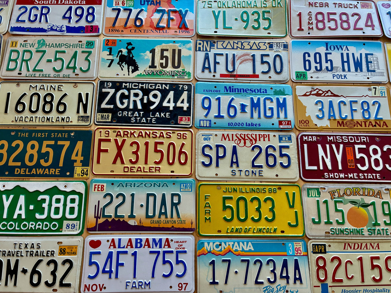 Authentic vintage license plates from many states, years, and conditions