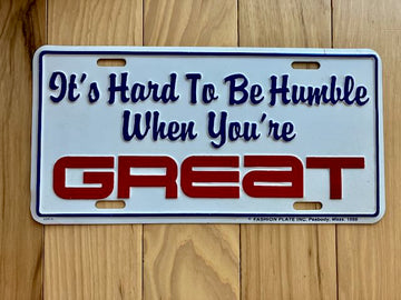 1986 It's Hard to Be Humble When You Are Great Metal Booster License Plate