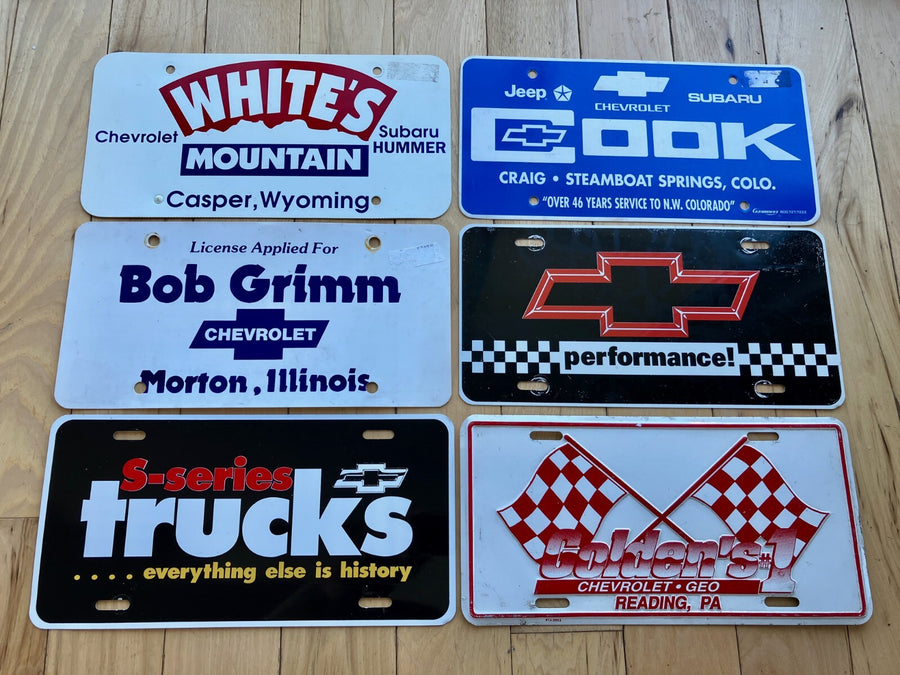 6 Chevy Booster License - Mix of Plastic and Metal - All at least 2019 and Older