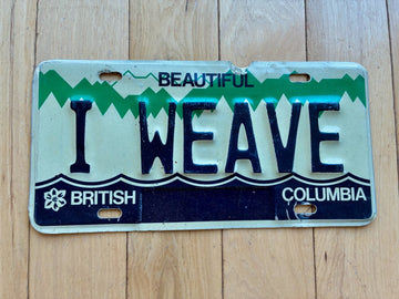 1984 British Columbia Vanity License Plate - I WEAVE (Damage On Top Above A)