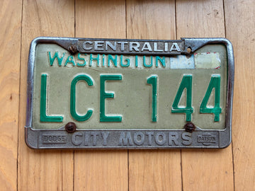 1968 to 1986 Washington State License Plate W/ Centralia City Motors Frame
