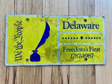 1987 Delaware We The People Booster License Plate - Poor Condition