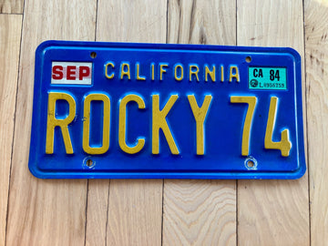 1984 California Vanity License Plate - ROCY 74