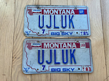 Pair of 1980s Montana Vanity License Plates - UJLUK - Tabs from 1981 and 1983