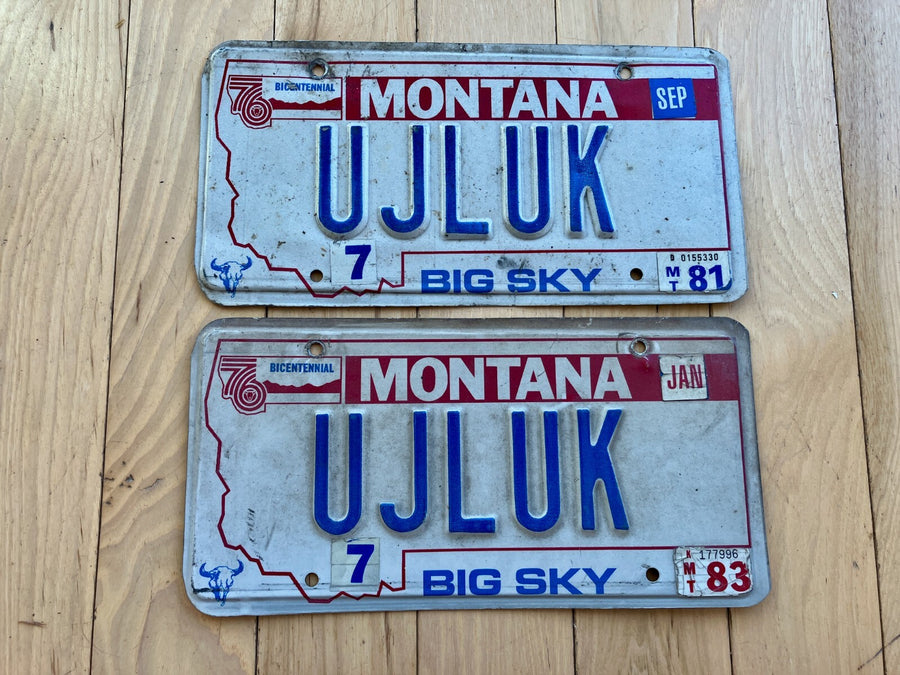 Pair of 1980s Montana Vanity License Plates - UJLUK - Tabs from 1981 and 1983