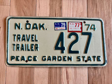 1974 North Dakota Trailer License Plate with 77 and 79 Tabs